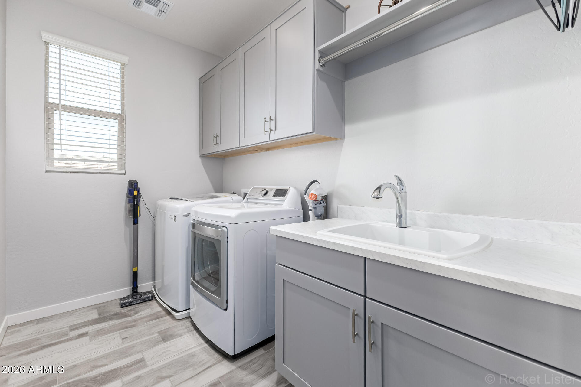 3494 East Spring Wheat Lane Gilbert, AZ 85296 - Photo 31 of 39 a utility room with sink dryer and washer