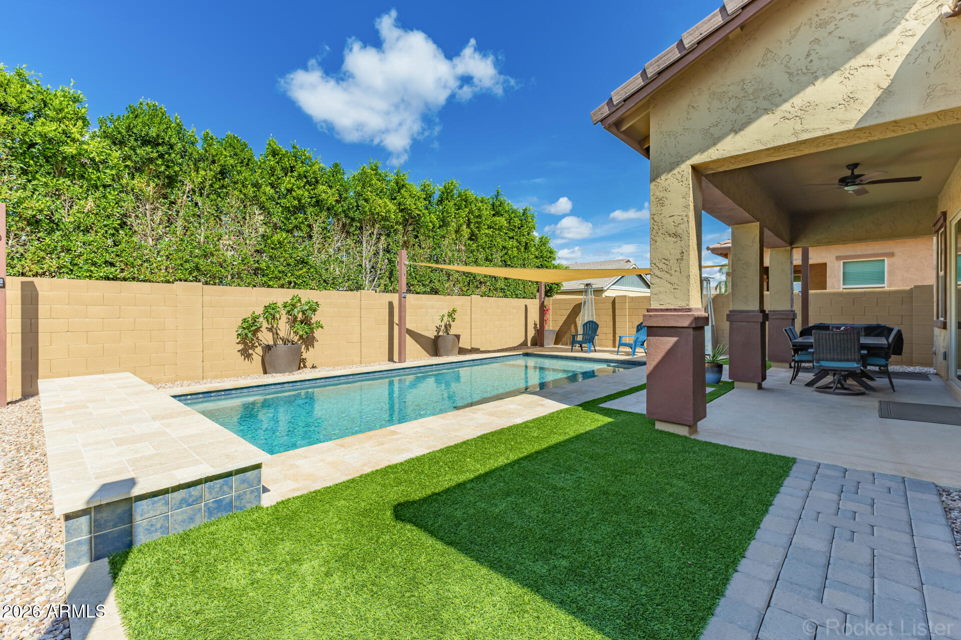 3494 East Spring Wheat Lane Gilbert, AZ 85296 - Photo 35 of 39 a view of a backyard with sitting area