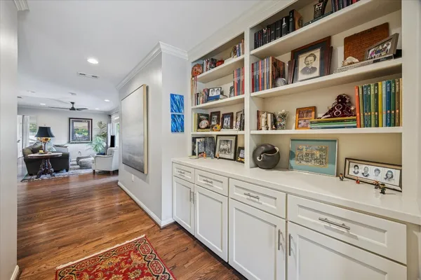 a utility room with cabinets washer and dryer