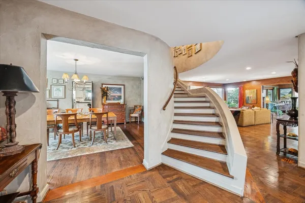 a large kitchen with a large window and stainless steel appliances