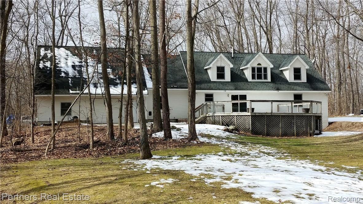 5371 Dutton Road Gregory, MI 48137 - Photo 3 of 72 Large deck off of the dining area leads to the private wooded site.