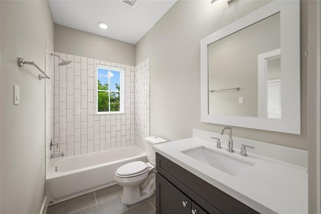105 West Whitney Street, Unit B Houston, TX 77018 - Photo 4 of 11 a bathroom with a sink toilet tub and shower