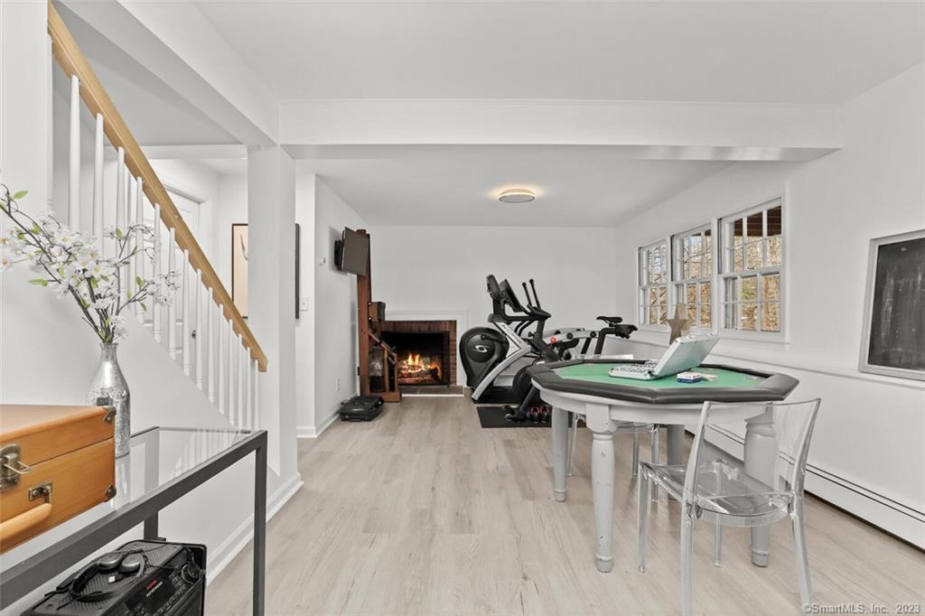 183 Frogtown Road New Canaan, CT 06840 - Photo 22 of 37 a view of a livingroom with furniture a table and chairs