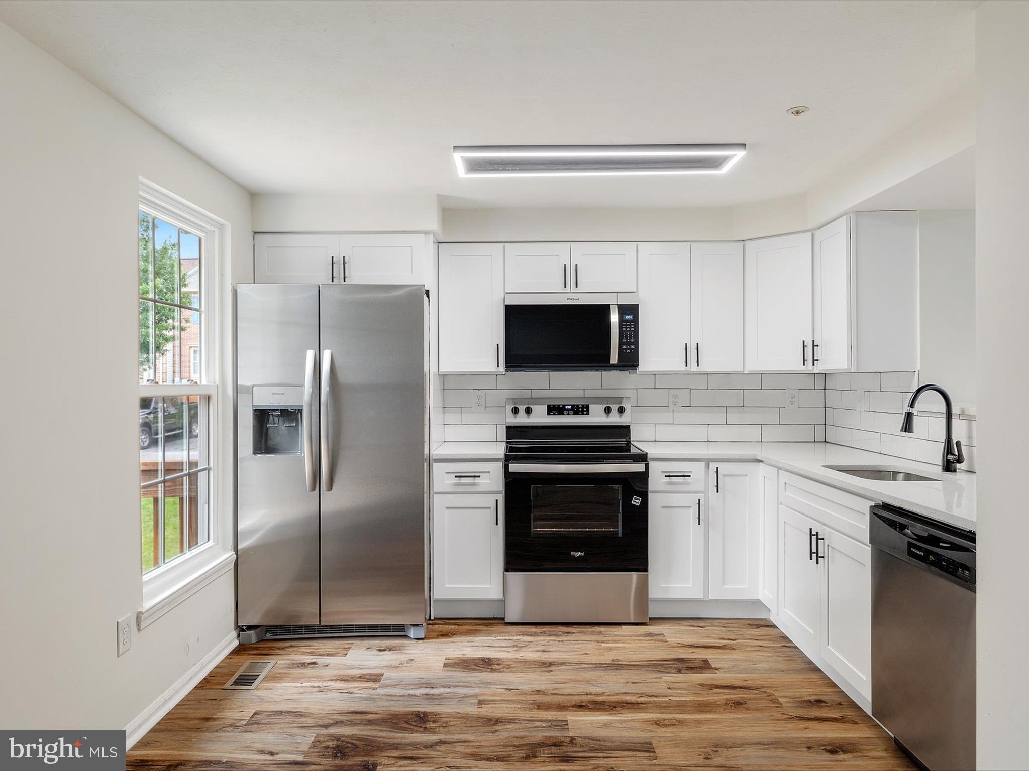 4226 Red Haven Road Baltimore, MD 21208 - Photo 2 of 32 a kitchen with stainless steel appliances granite countertop a refrigerator stove and sink