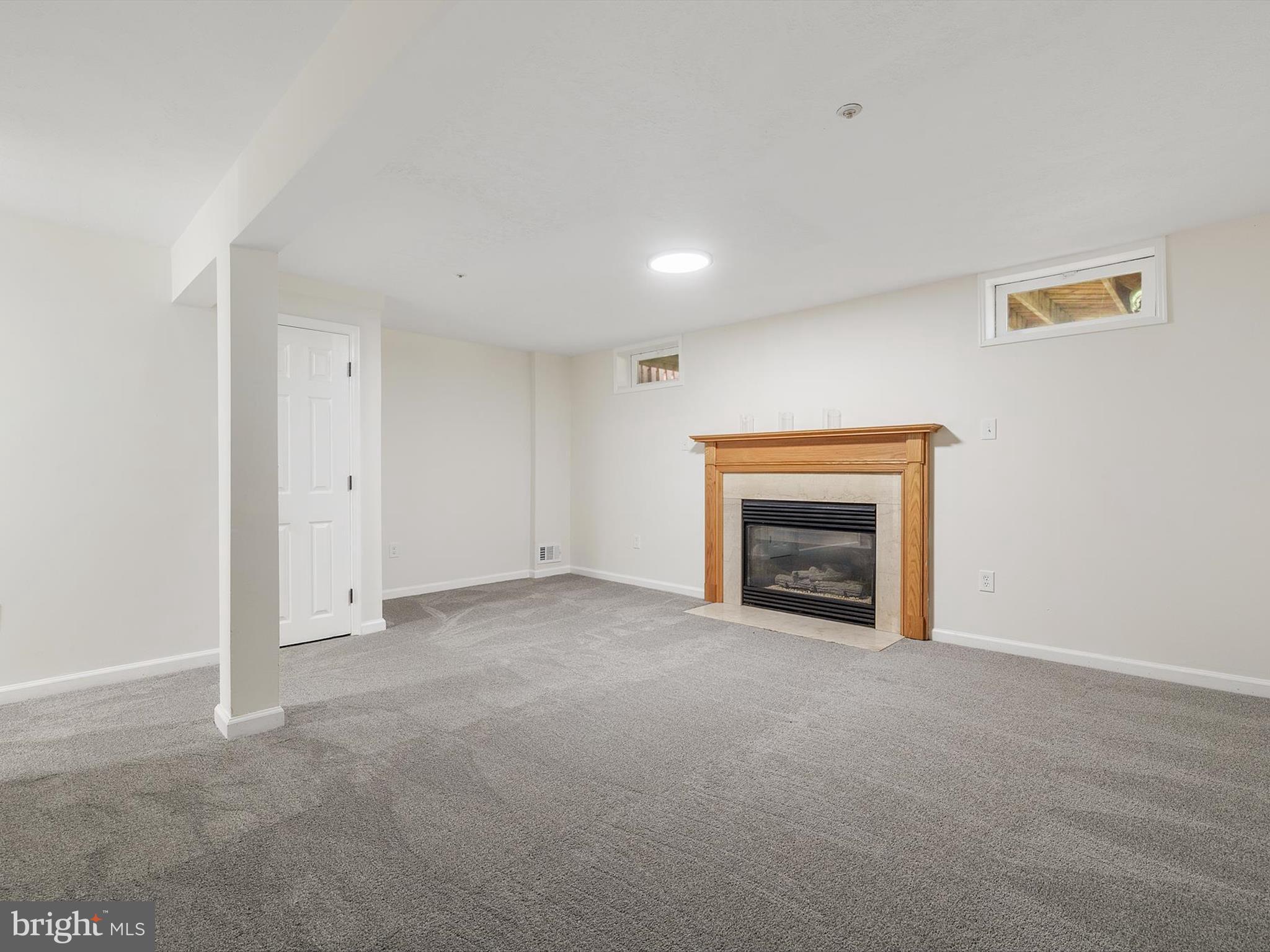 4226 Red Haven Road Baltimore, MD 21208 - Photo 23 of 32 a view of an empty room with a fireplace