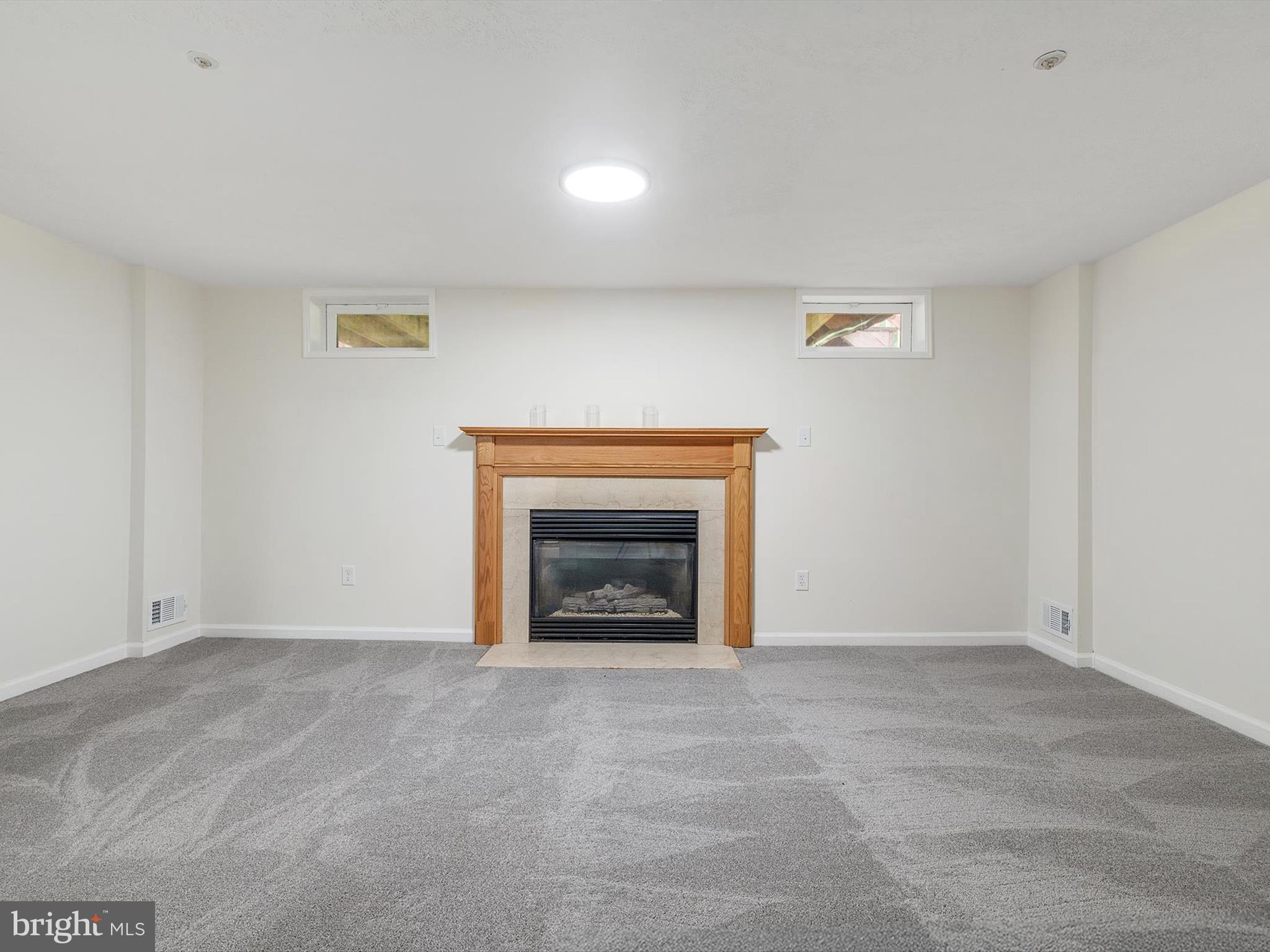 4226 Red Haven Road Baltimore, MD 21208 - Photo 24 of 32 a view of an empty room with a fireplace