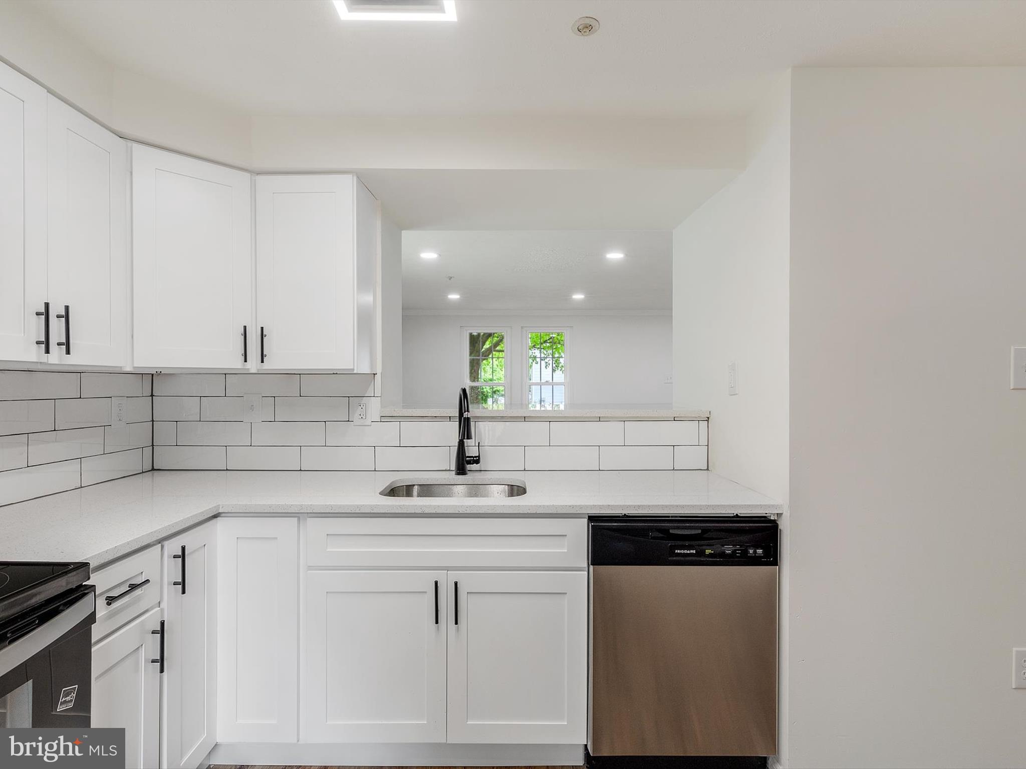4226 Red Haven Road Baltimore, MD 21208 - Photo 6 of 32 a kitchen with a sink cabinets and window