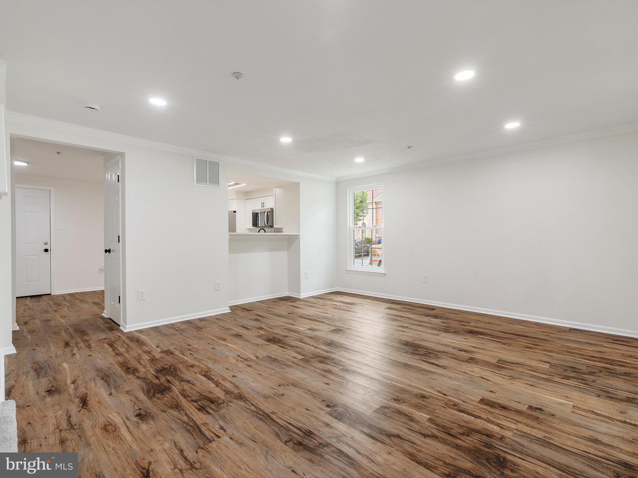 4226 Red Haven Road Baltimore, MD 21208 - Photo 7 of 32 a view of empty room with wooden floor