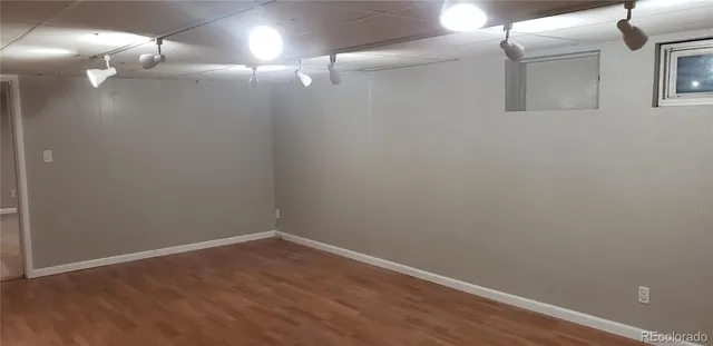 a view of a room with wooden floor