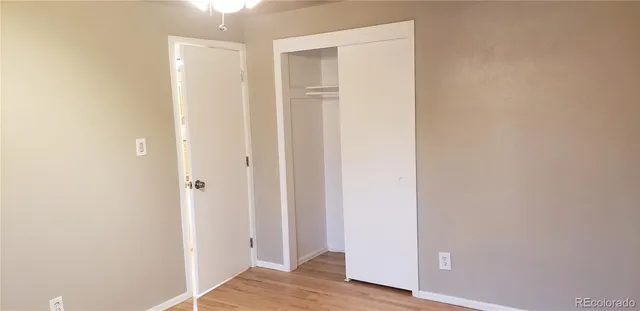 a view of hallway with wooden floor