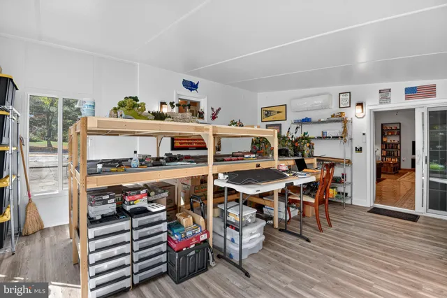 a bedroom with a bed and a table in it