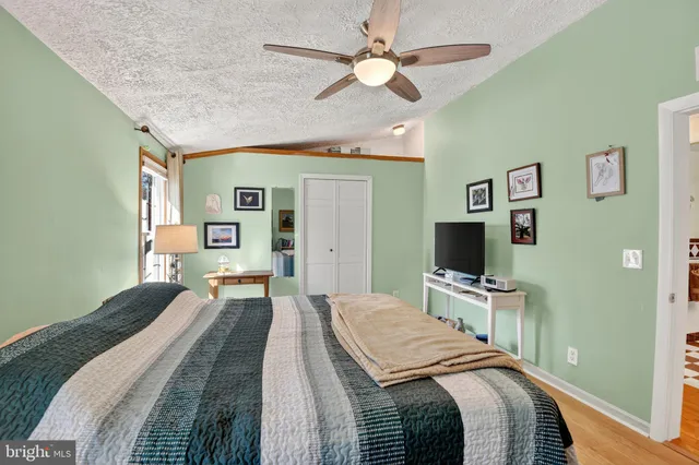 a bathroom with a shower toilet and sink