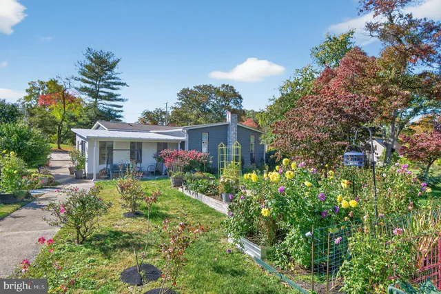 a view of a backyard with sitting area
