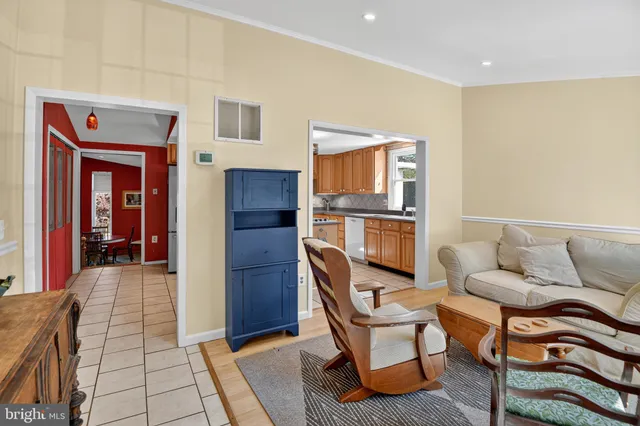 a living room with a couch and a stove top oven