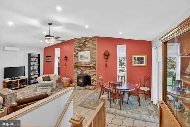 a living room with furniture or couch and a fireplace