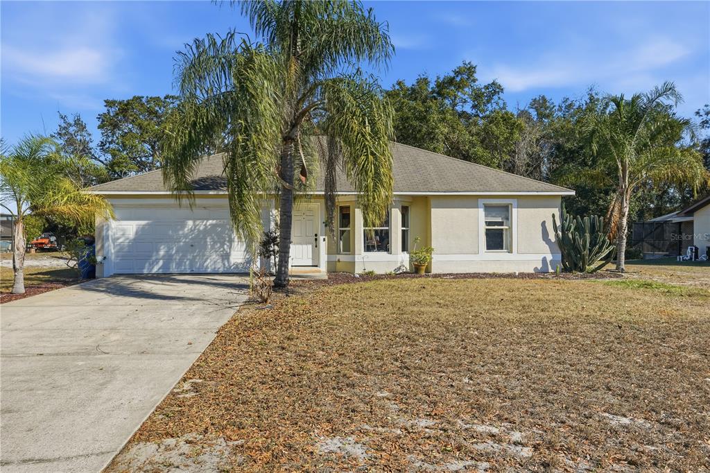 front view of a house with a yard