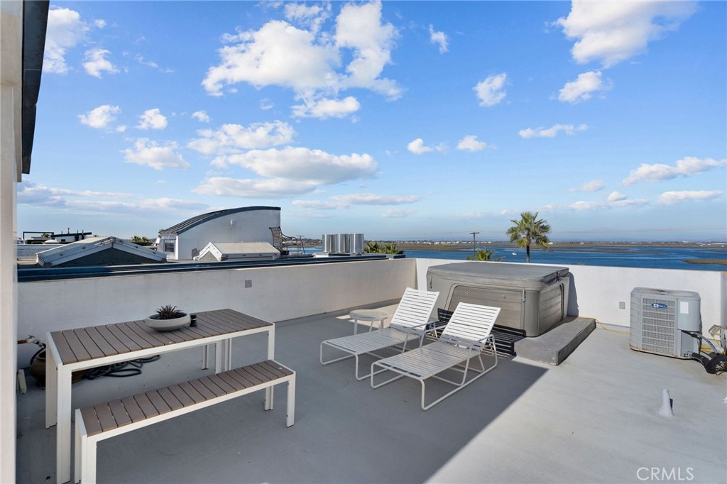 73 B Surfside Surfside, CA 90743 - Photo 31 of 40 back of rooftop deck with hot tub and back bay views