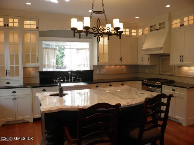 a kitchen with a kitchen island and a stove