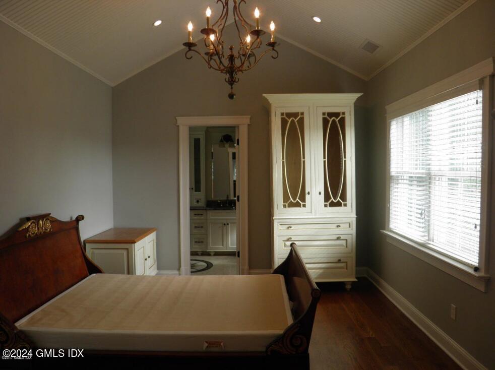 1 Field Road Cos Cob, CT 06807 - Photo 13 of 22 a bed room with a bed and a chandelier
