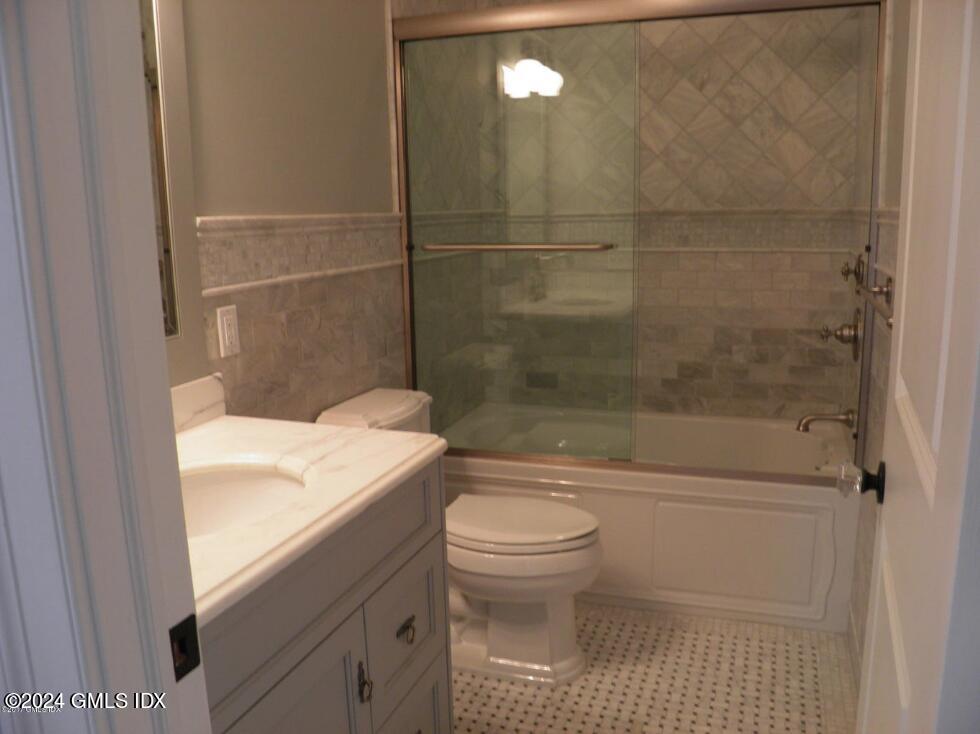 1 Field Road Cos Cob, CT 06807 - Photo 18 of 22 a bathroom with a sink a toilet and shower