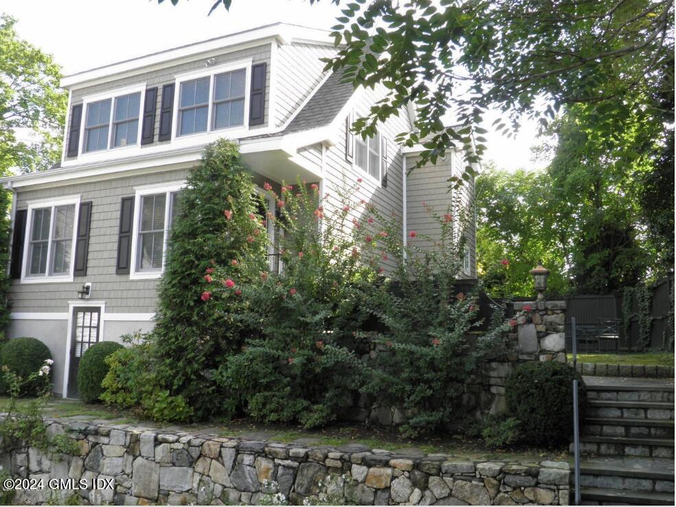 1 Field Road Cos Cob, CT 06807 - Photo 20 of 22 a front view of a house with a garden