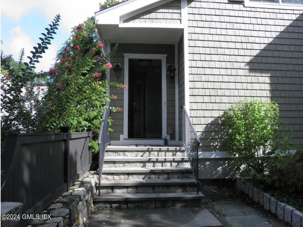 1 Field Road Cos Cob, CT 06807 - Photo 21 of 22 a front view of a house with a garden