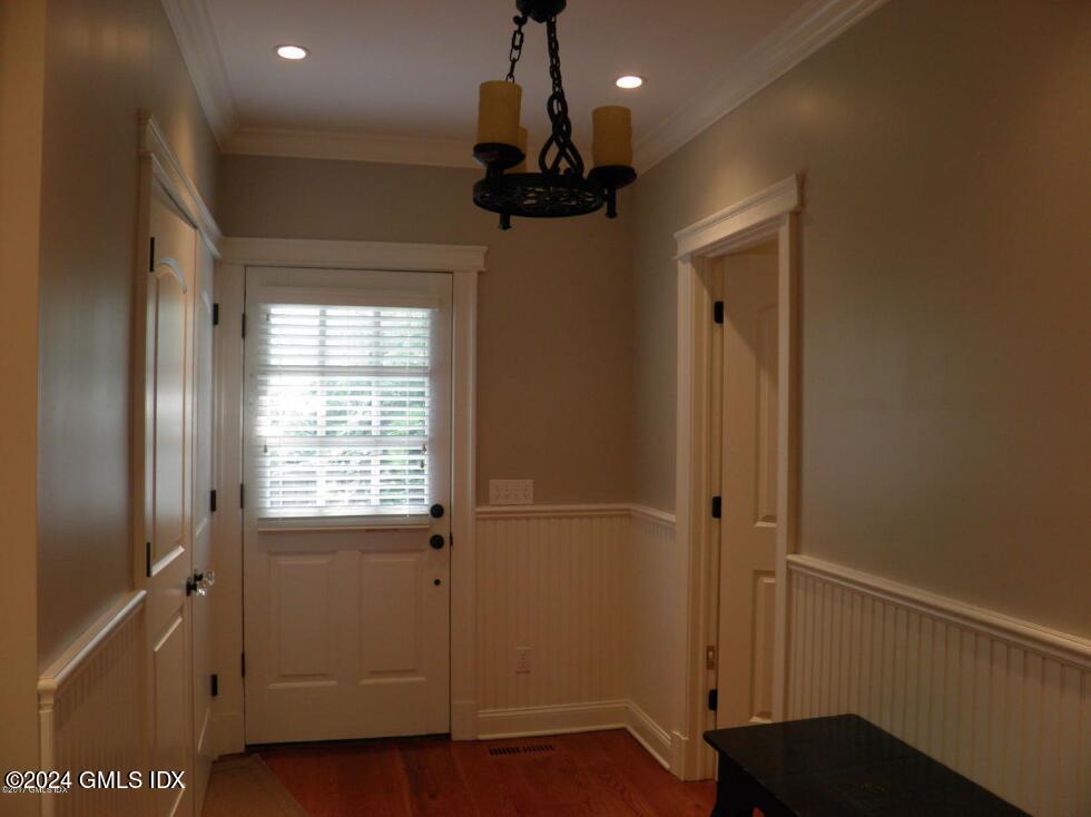 1 Field Road Cos Cob, CT 06807 - Photo 9 of 22 a view of empty room with wooden floor and fan
