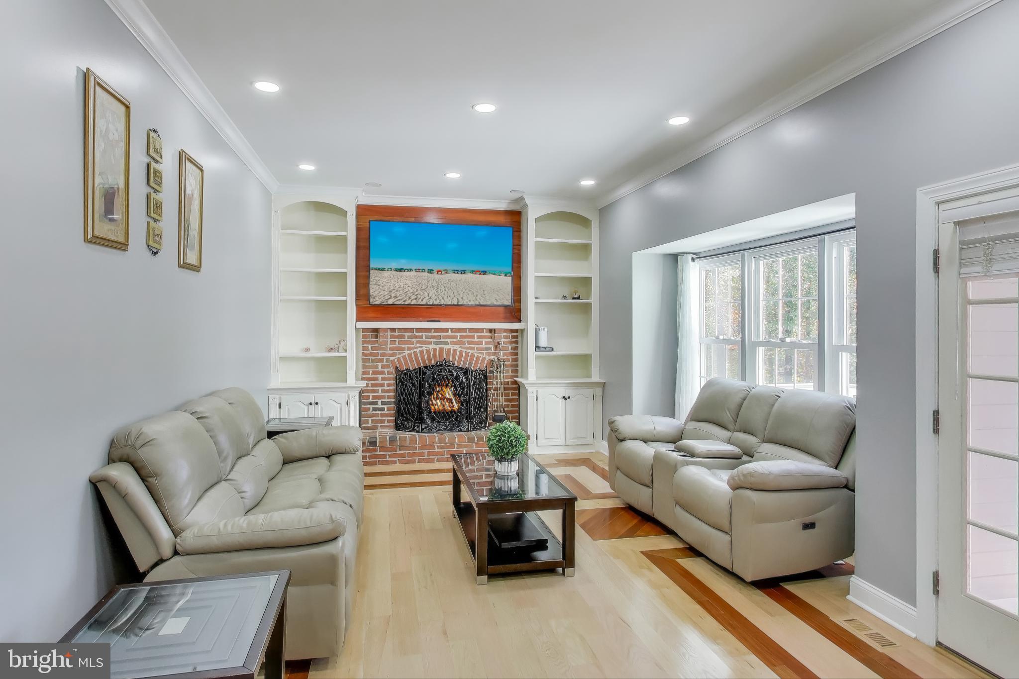 16702 Gooseneck Terrace Olney, MD 20832 - Photo 15 of 65 a living room with furniture and a fireplace