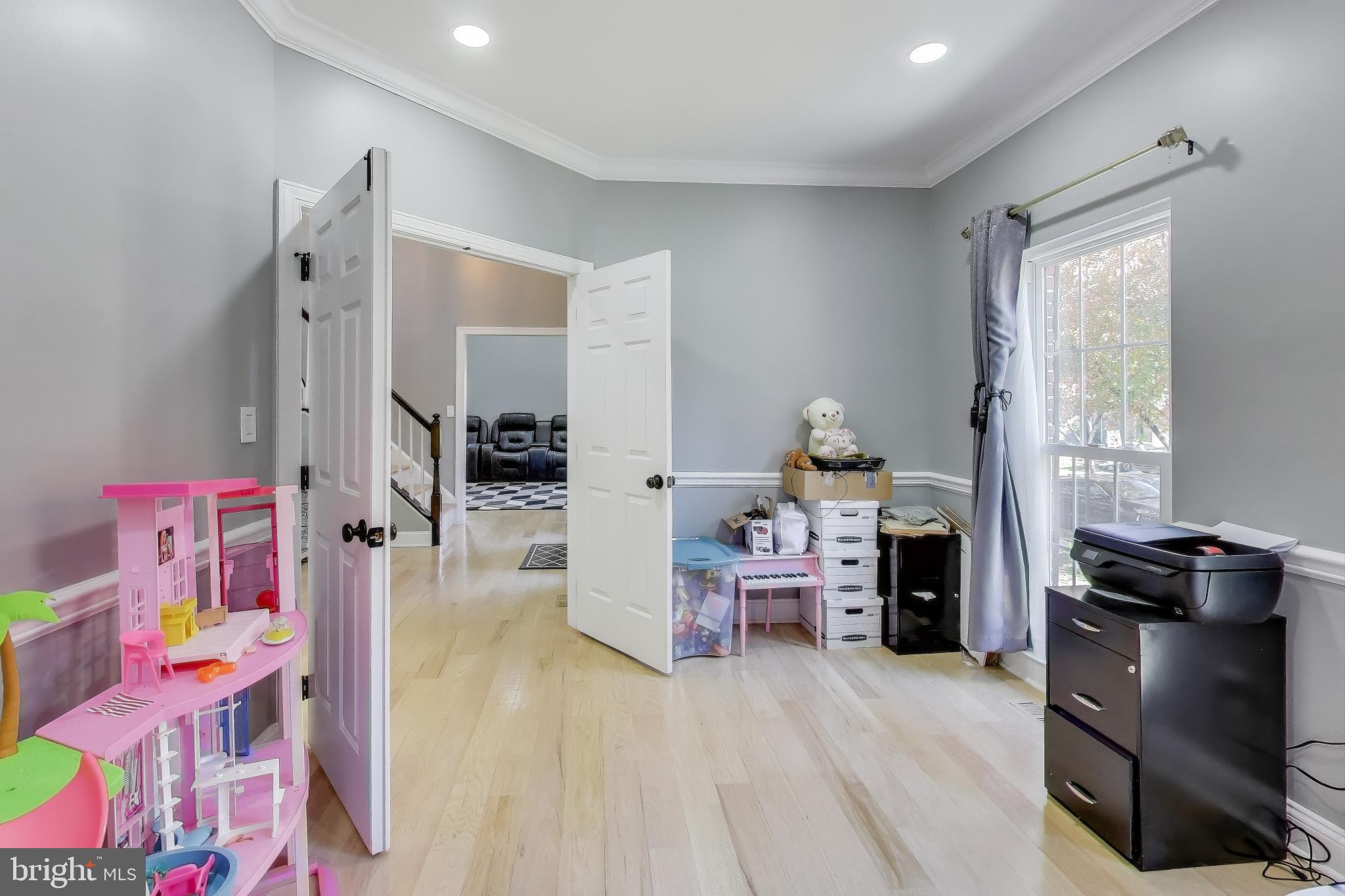 16702 Gooseneck Terrace Olney, MD 20832 - Photo 21 of 65 a living room with furniture and a flat screen tv