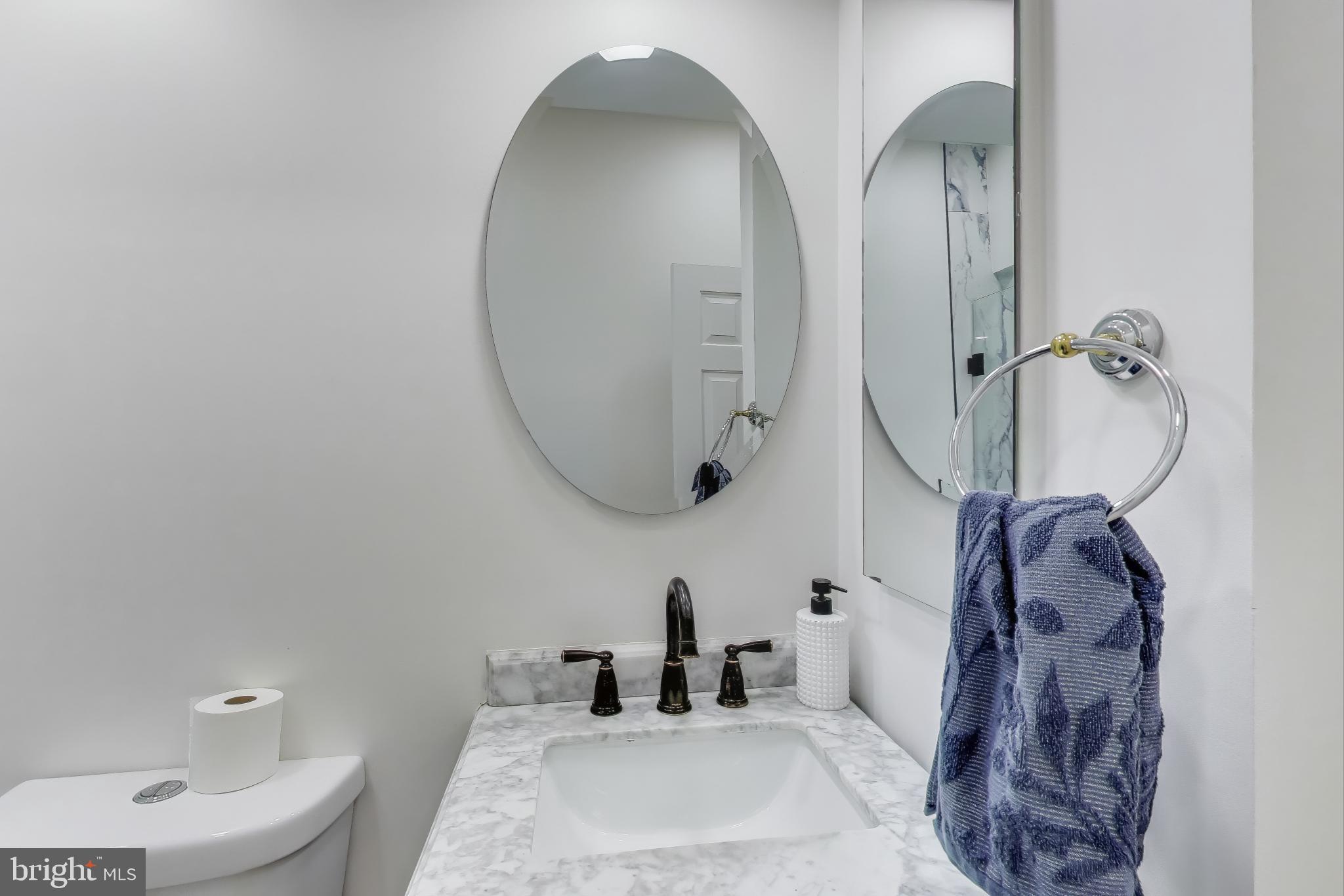 16702 Gooseneck Terrace Olney, MD 20832 - Photo 22 of 65 a bathroom with double vanity sink toilet and shower