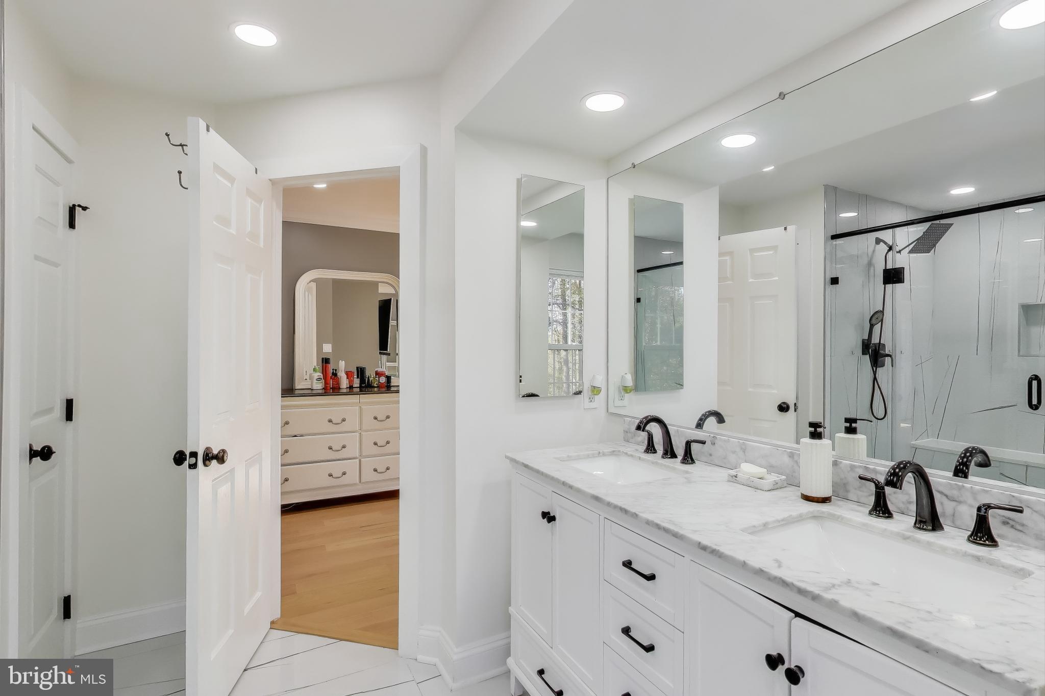 16702 Gooseneck Terrace Olney, MD 20832 - Photo 30 of 65 a bathroom with a double vanity sink mirror and shower
