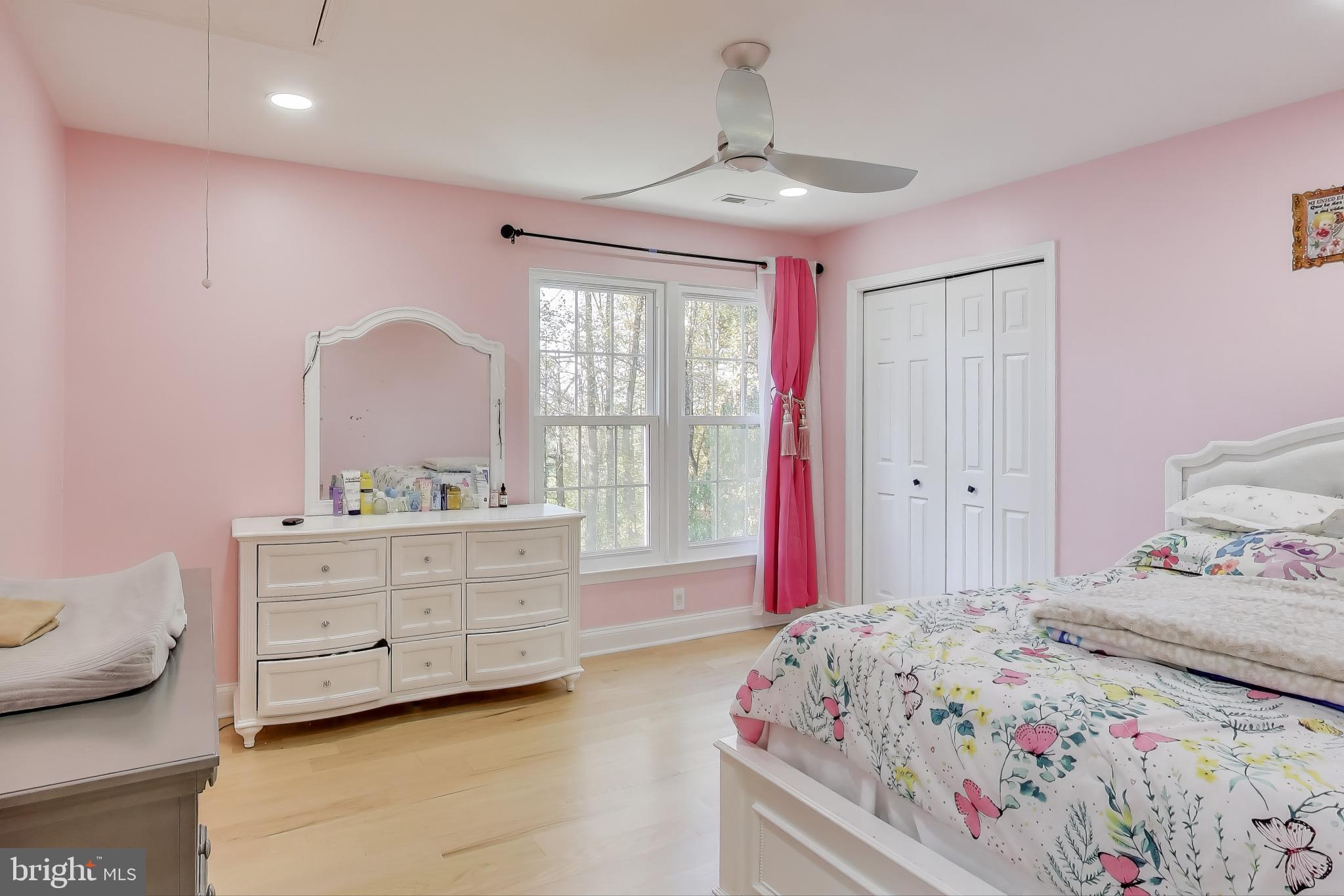 16702 Gooseneck Terrace Olney, MD 20832 - Photo 34 of 65 a bedroom with a bed and a dresser