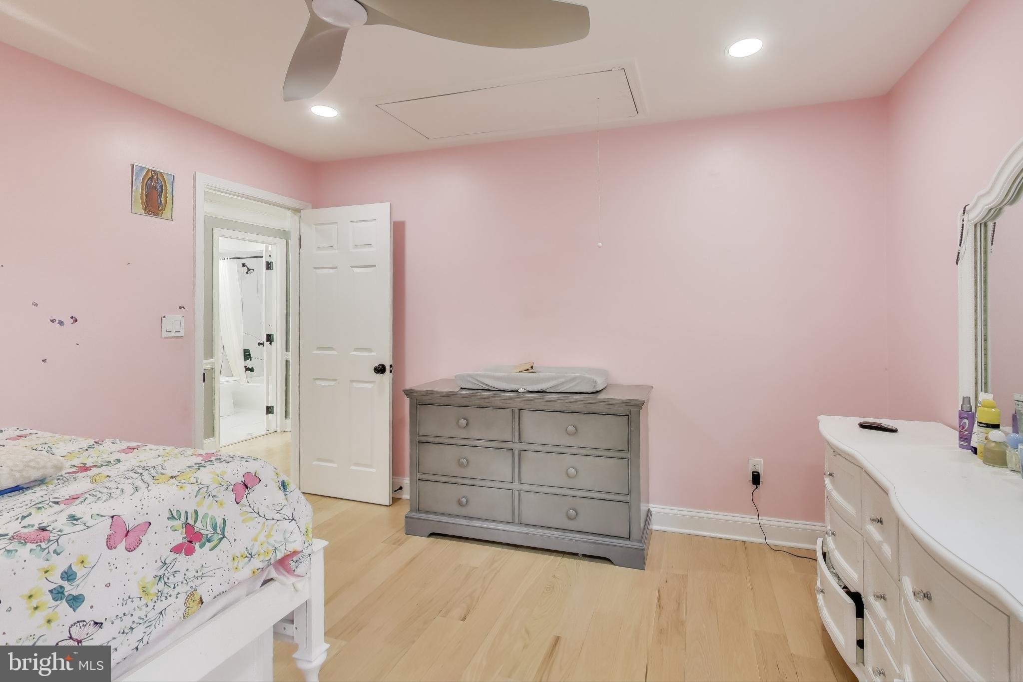 16702 Gooseneck Terrace Olney, MD 20832 - Photo 35 of 65 a bedroom with a bed and a dresser