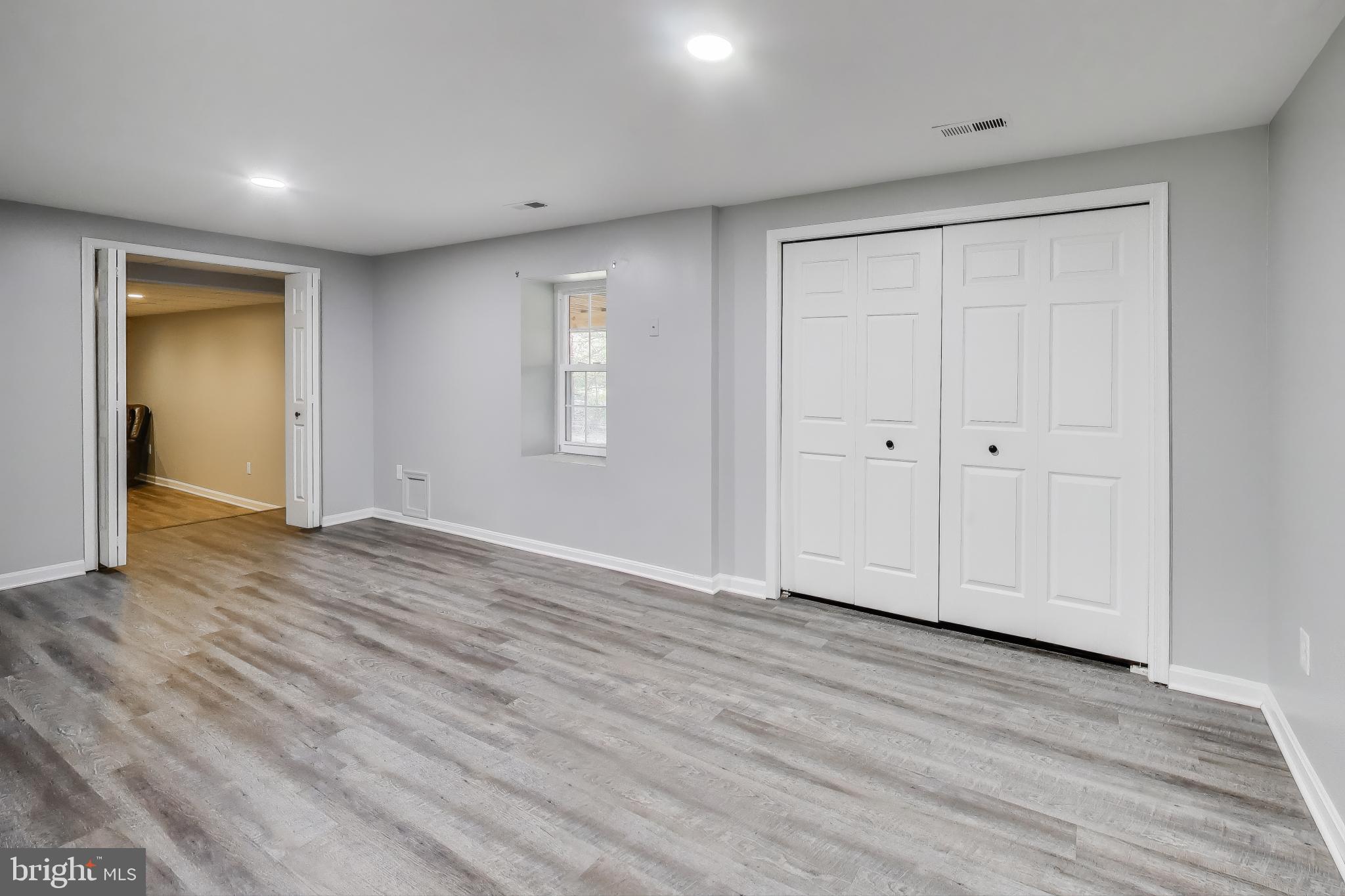 16702 Gooseneck Terrace Olney, MD 20832 - Photo 44 of 65 a view of empty room with wooden floor and entryway