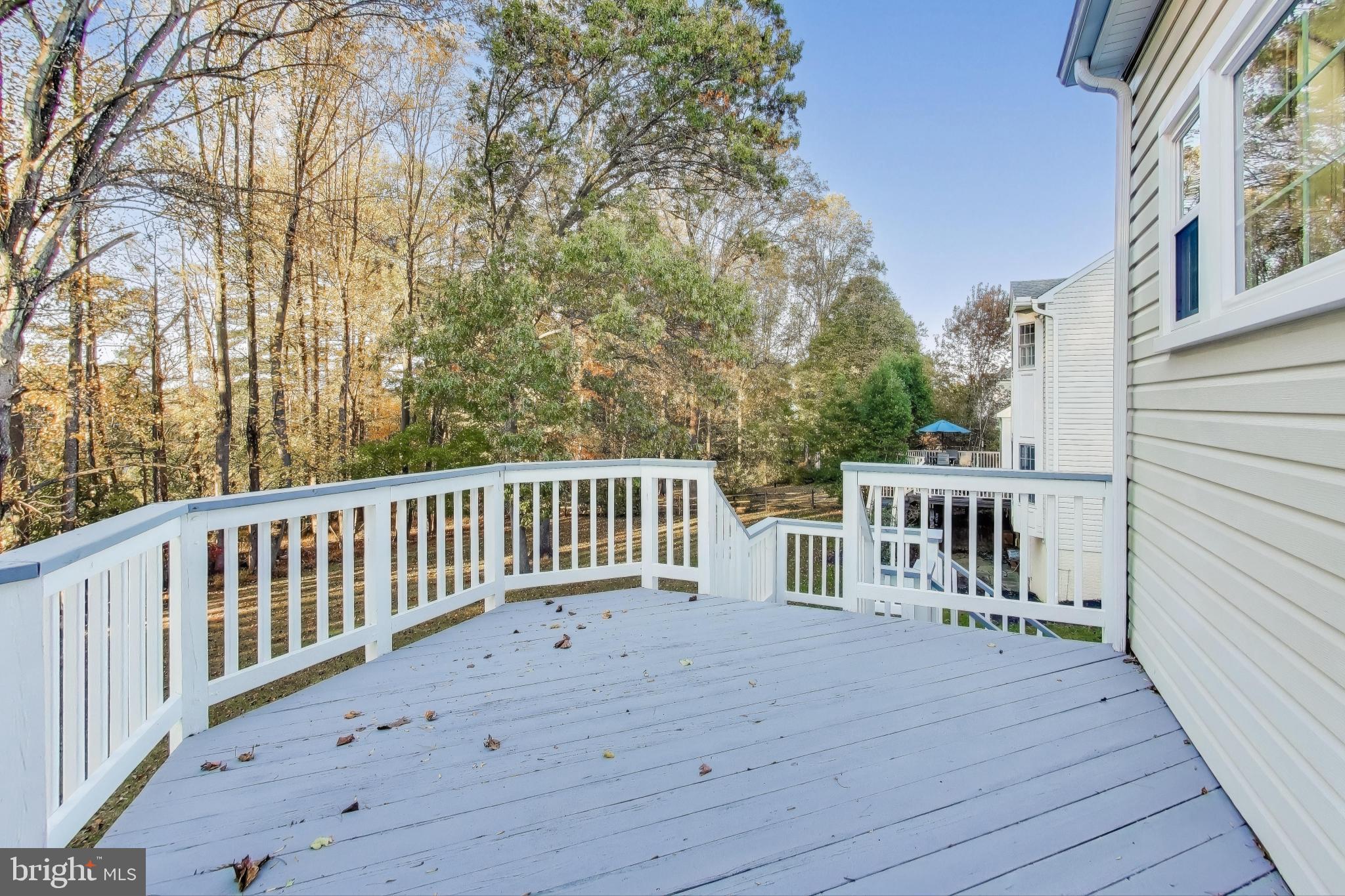 16702 Gooseneck Terrace Olney, MD 20832 - Photo 51 of 65 a balcony with wooden floor and fence