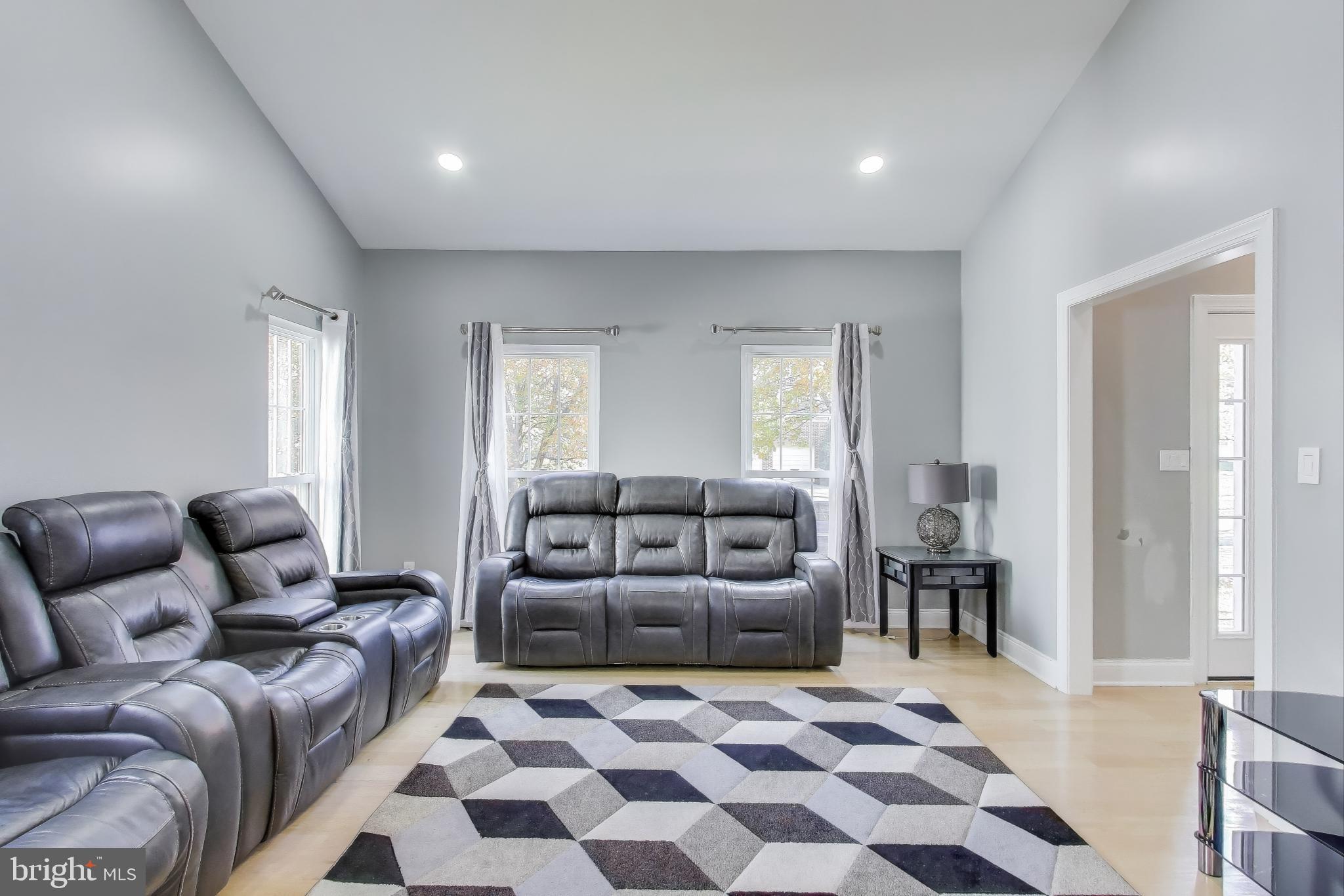 16702 Gooseneck Terrace Olney, MD 20832 - Photo 7 of 65 a living room with furniture and a rug