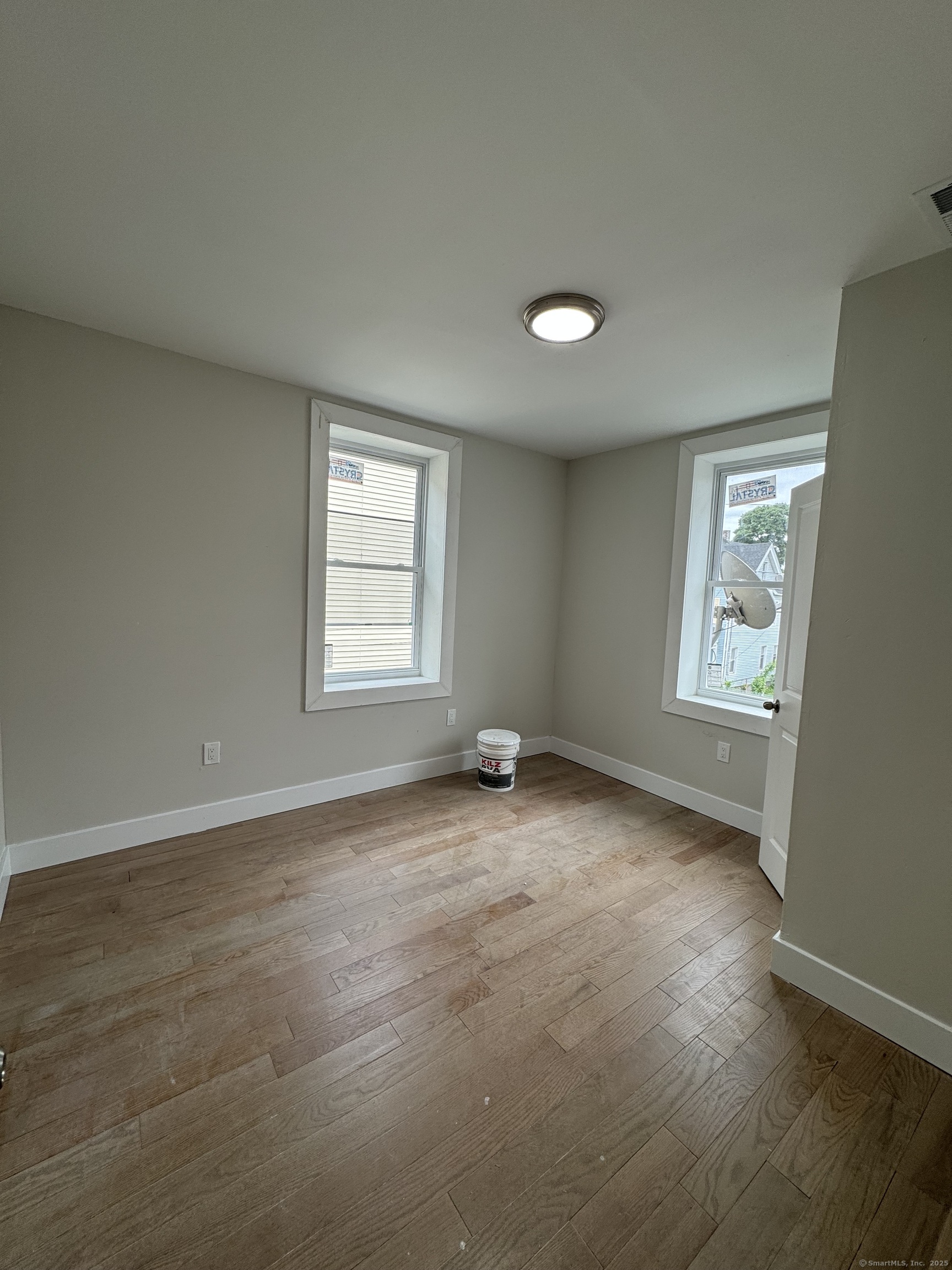 485 Howard Avenue, Unit 6 New Haven, CT 06519 - Photo 2 of 4 an empty room with windows