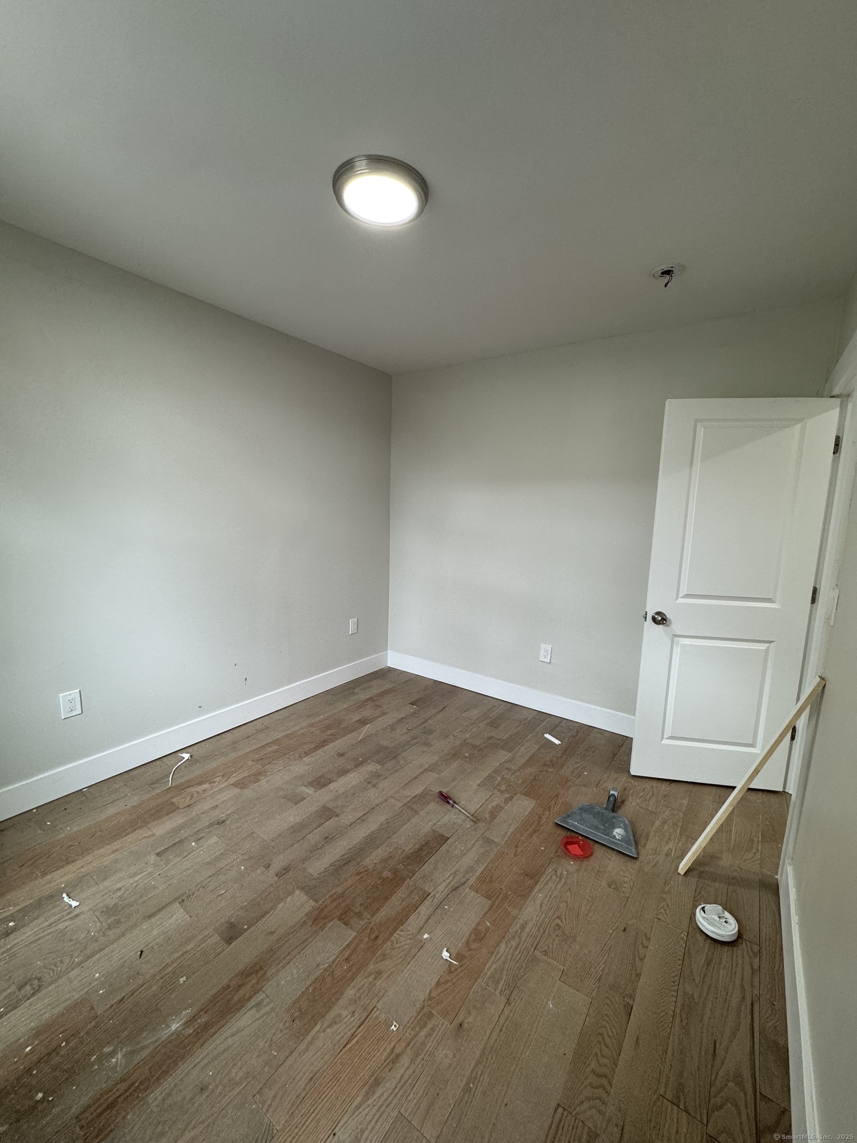 485 Howard Avenue, Unit 6 New Haven, CT 06519 - Photo 3 of 4 a view of empty room with wooden floor