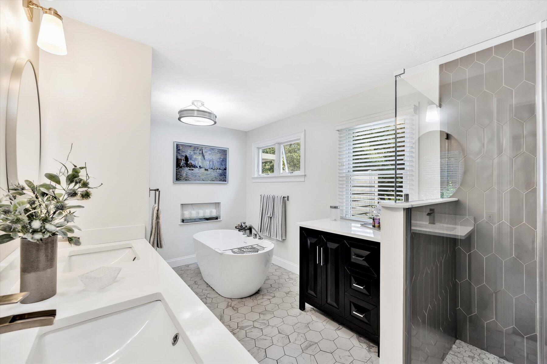 1 Ravens Nest Road Sandwich, MA 02563 - Photo 15 of 46 a spacious bathroom with a bathtub sink and mirror