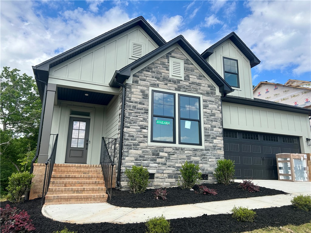 131 Shale Drive Central, SC 29630 - Photo 1 of 11 This newly constructed residence showcases a contemporary facade with a blend of natural stone and siding.