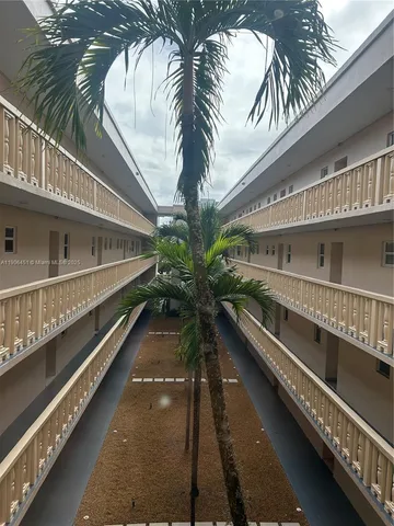 a view of swimming pool with outdoor seating
