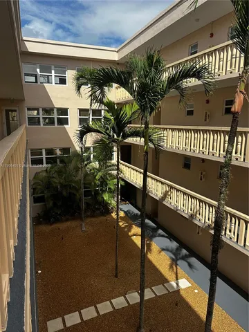 a view of swimming pool with outdoor seating and yard