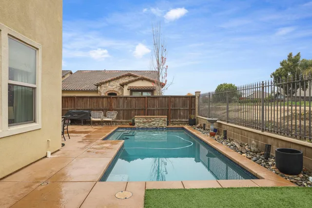 a view of a balcony with a floor to ceiling window and a basket ball poll
