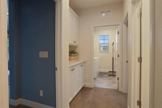 a view of a bathroom from a hallway