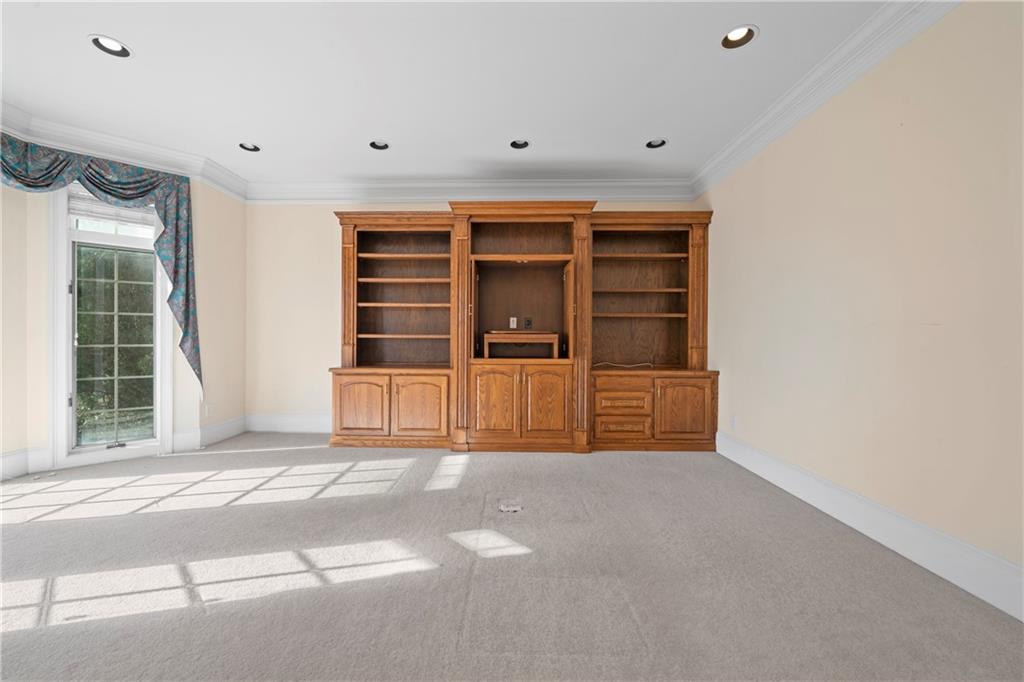 5414 Price Road Gainesville, GA 30506 - Photo 21 of 82 a view of an empty room with a fireplace and a window