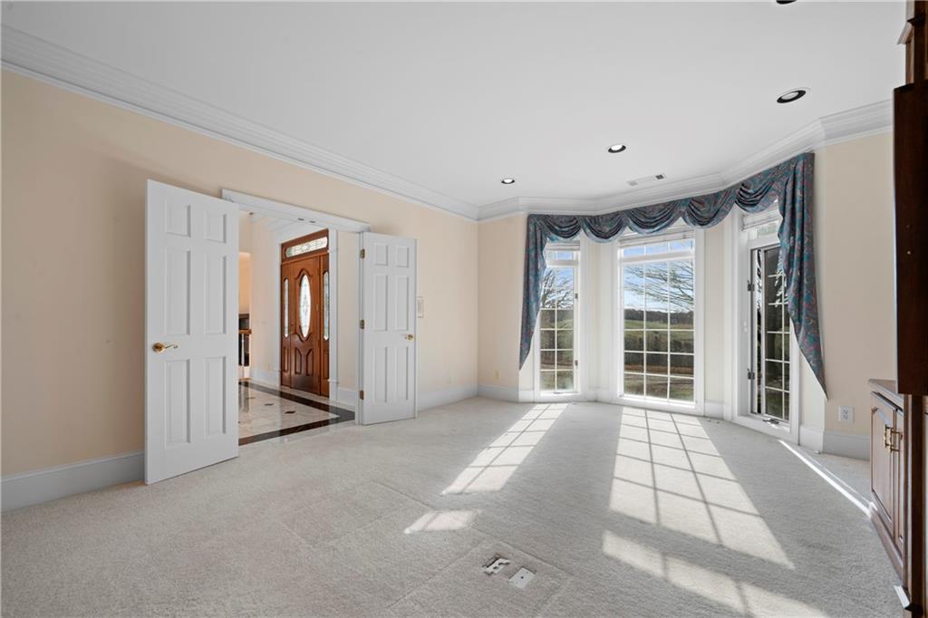 5414 Price Road Gainesville, GA 30506 - Photo 22 of 82 a view of a big room with windows and entryway