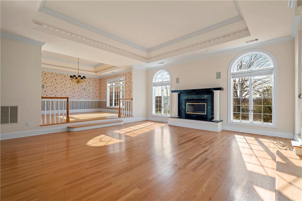 5414 Price Road Gainesville, GA 30506 - Photo 23 of 82 a view of an empty room with wooden floor fireplace and a window
