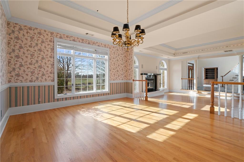 5414 Price Road Gainesville, GA 30506 - Photo 27 of 82 a view of a livingroom with wooden floor and a refrigerator