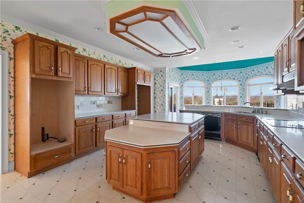 5414 Price Road Gainesville, GA 30506 - Photo 29 of 82 a kitchen with stainless steel appliances granite countertop a sink a stove and a refrigerator