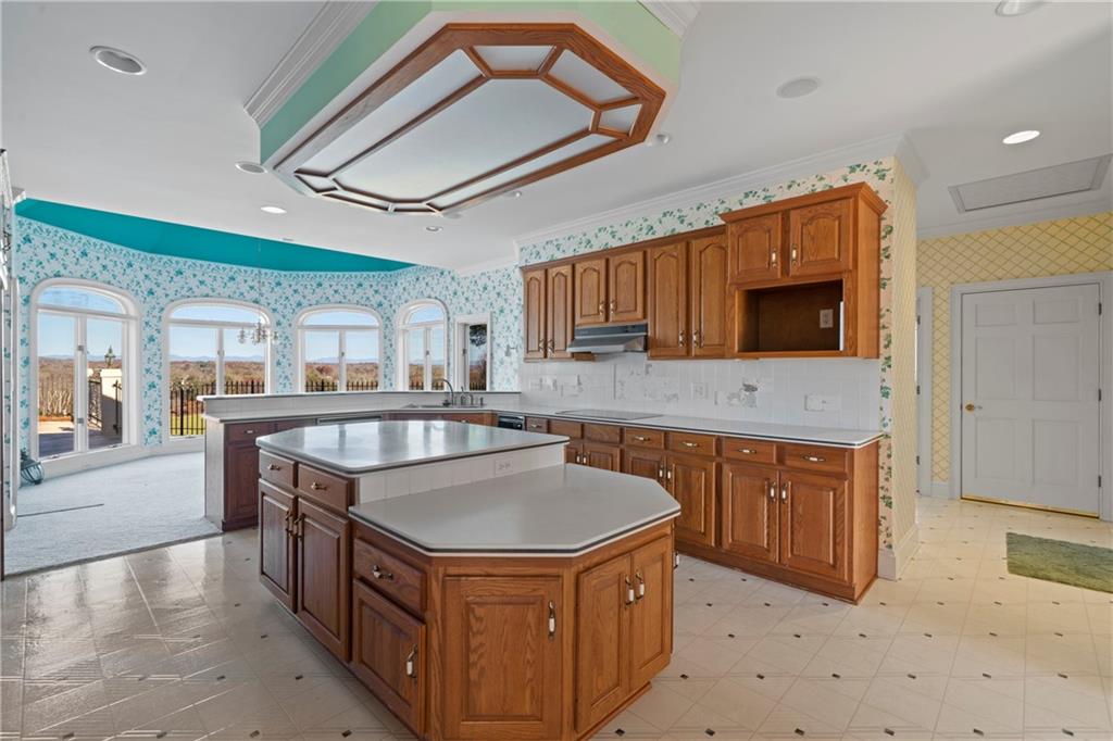 5414 Price Road Gainesville, GA 30506 - Photo 30 of 82 a kitchen with stainless steel appliances granite countertop a sink a stove a oven a counter top space and cabinets